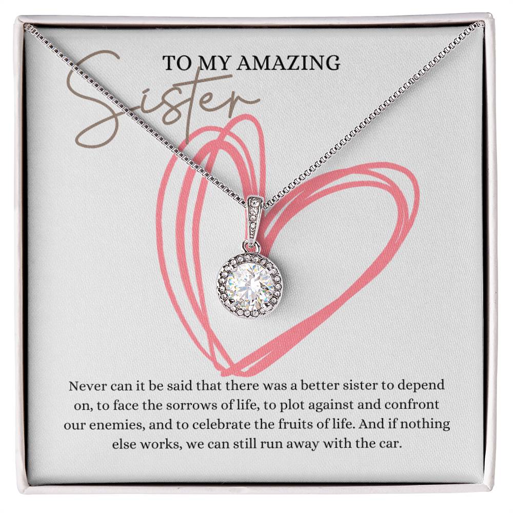 A necklace gift with a big cubic zirconia crystal pendant and a white gold finish, with a message card to my amazing sister, in a Jewelry box.