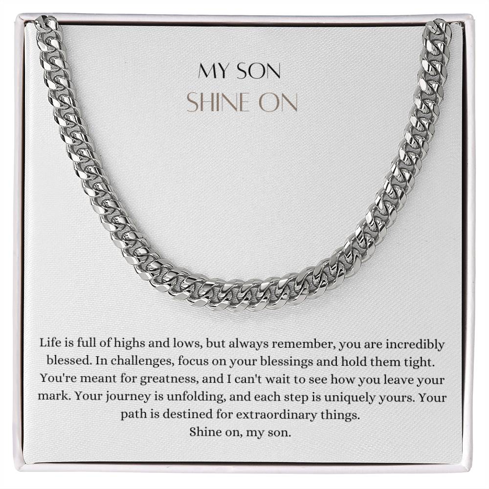 A Cuban chain necklace gift and a white gold finish, with a message card that says to my son, in a Jewelry box.
