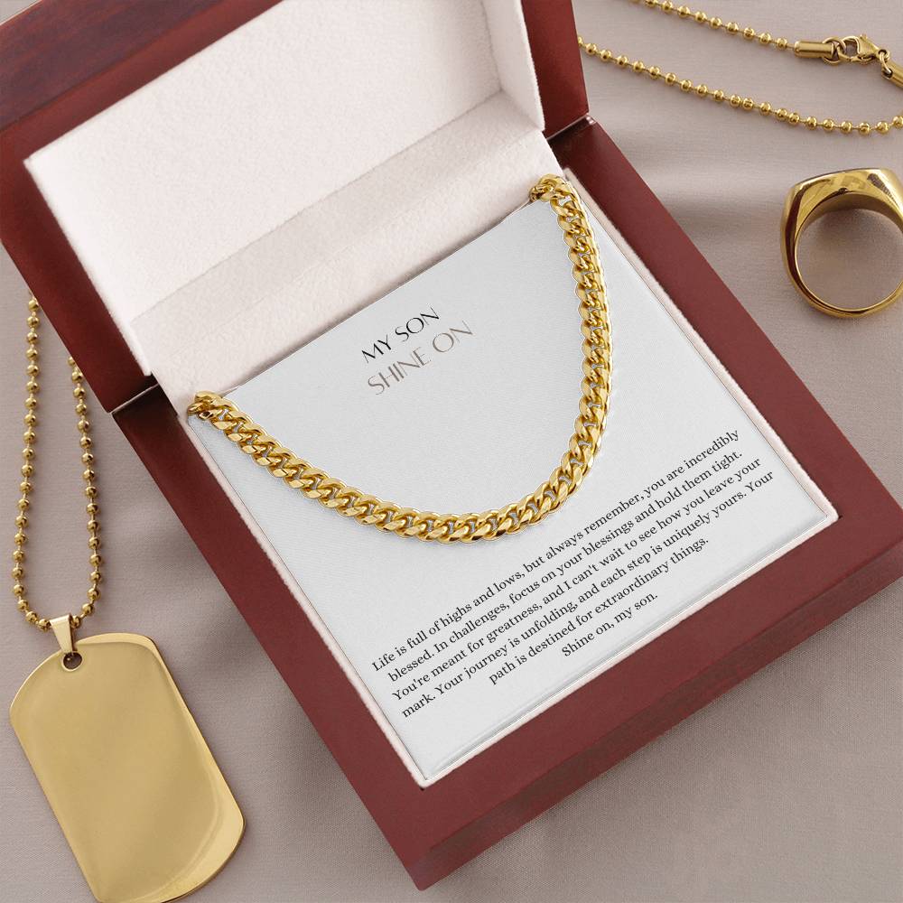 A Cuban chain necklace gift and a yellow gold finish, with a message card that says to my son, in a mahogany Jewelry box.
