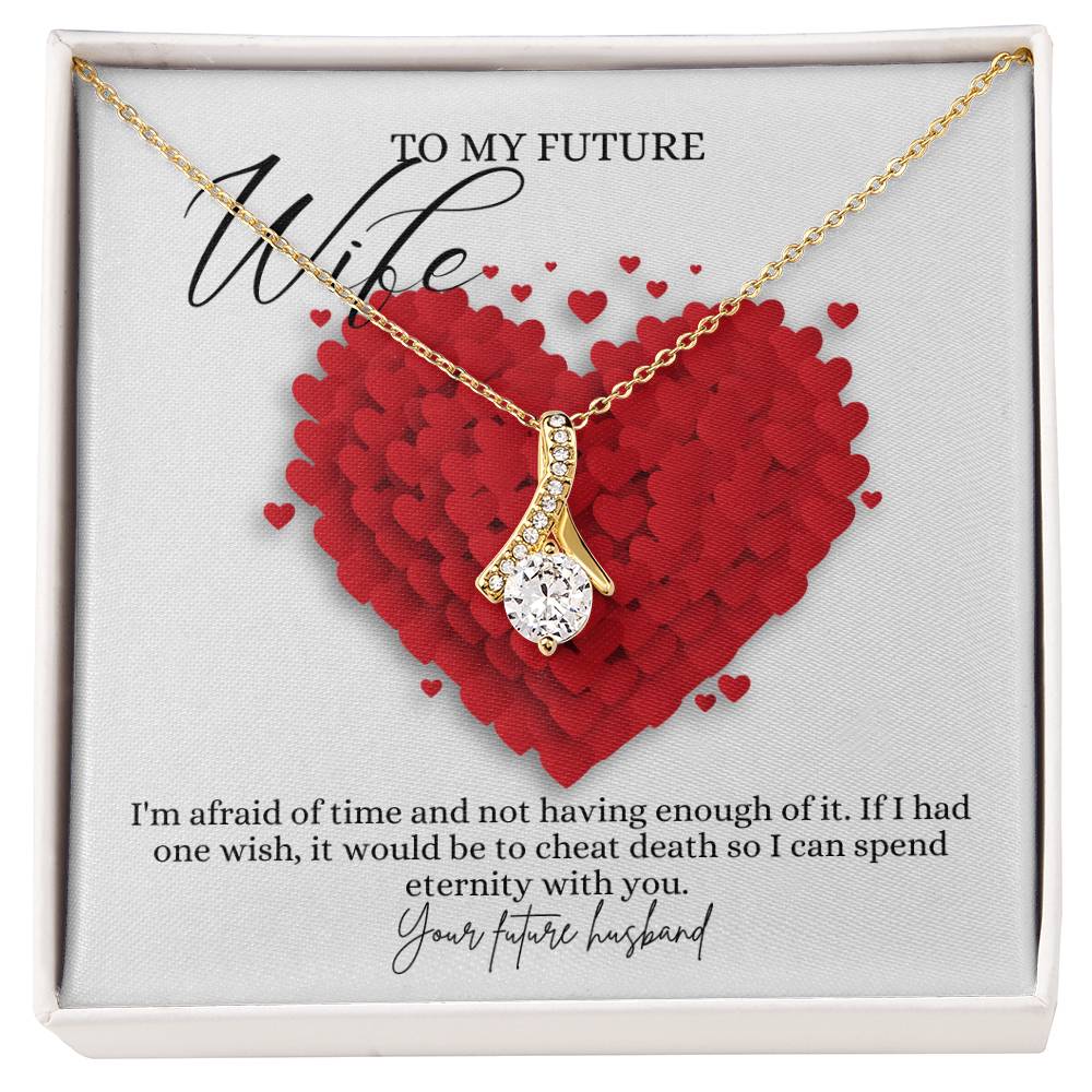 A necklace gift with ribbon shaped pendant with cubic zirconia crystals and a gold finish, with a message card to my future wife in a Jewelry box.