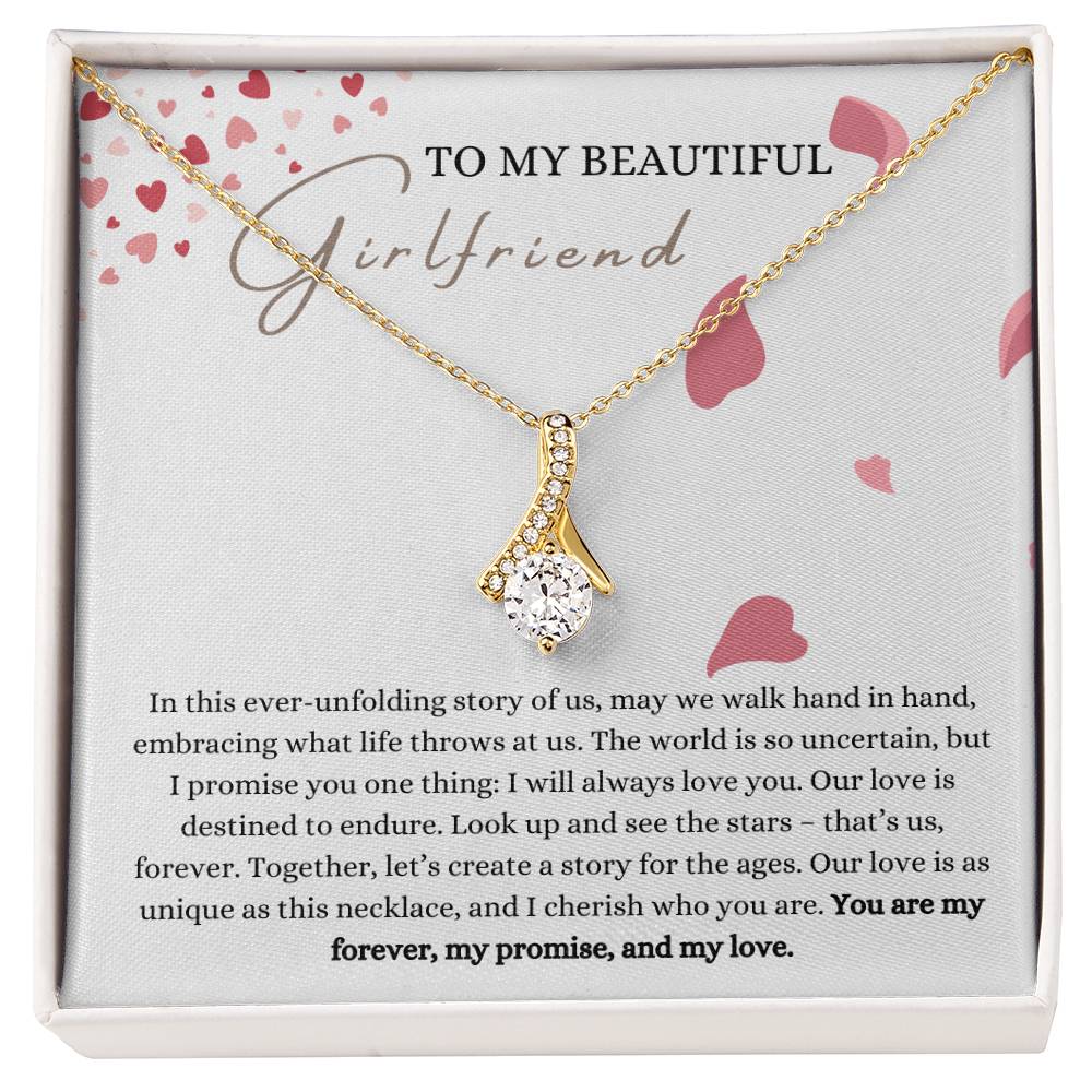 A necklace gift with ribbon shaped pendant with cubic zirconia crystals and a gold finish, with a message card to my beautiful girlfriend in a Jewelry box.