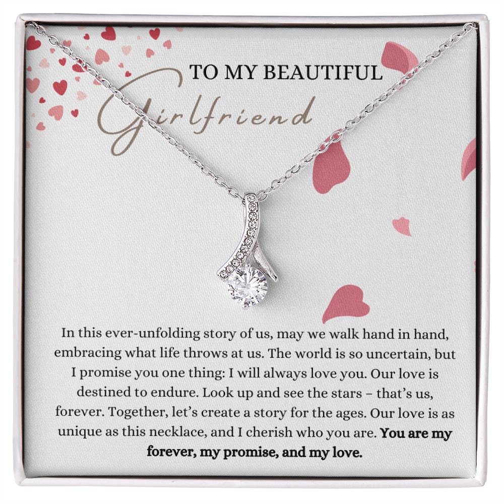 A necklace gift with ribbon shaped pendant with cubic zirconia crystals and white gold finish, with a message card to my beautiful girlfriend in a Jewelry box.