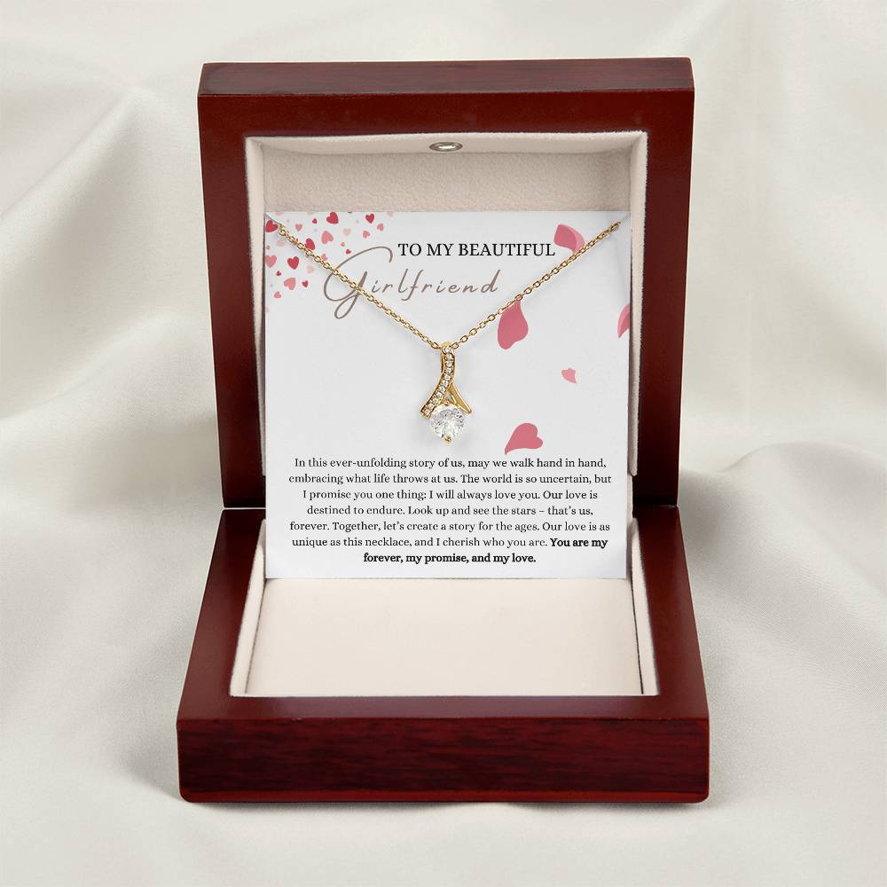 Necklace gift with ribbon shaped pendant with cubic zirconia crystals and white gold finish, with a message card to my beautiful girlfriend in a mahogany Jewelry box.