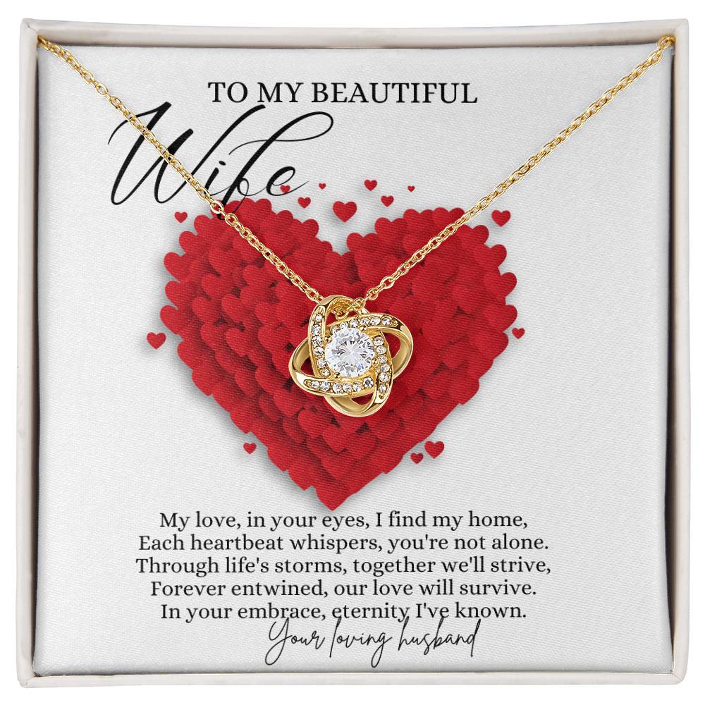 A yellow gold finish necklace gift, with a knot pendant embellished with premium cubic zirconia crystals, and a message card to my beautiful wife, in a Jewelry box.