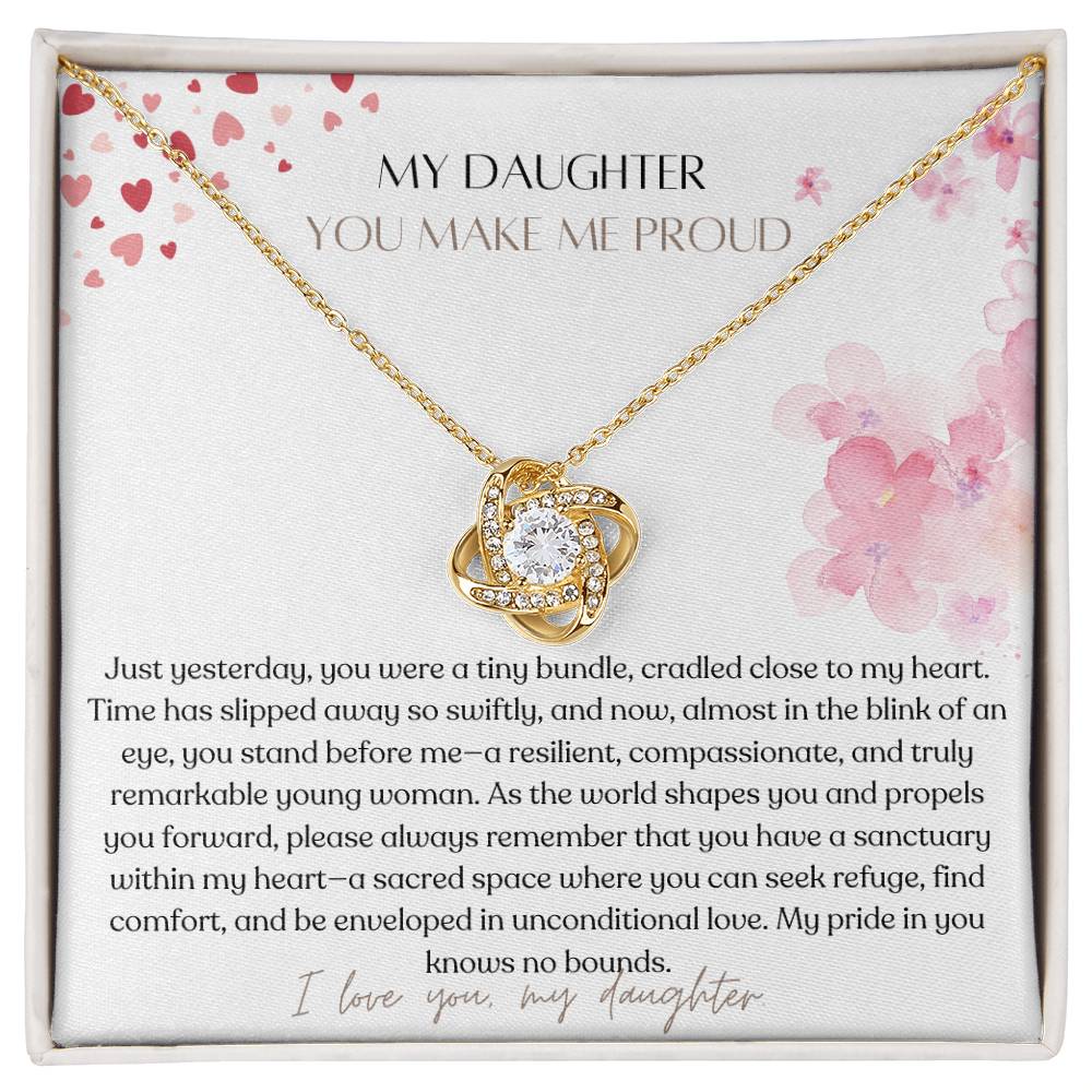 A Jewelry box, with a yellow gold finish necklace gift, with a knot pendant embellished with premium cubic zirconia crystals, and a message card to my daughter.