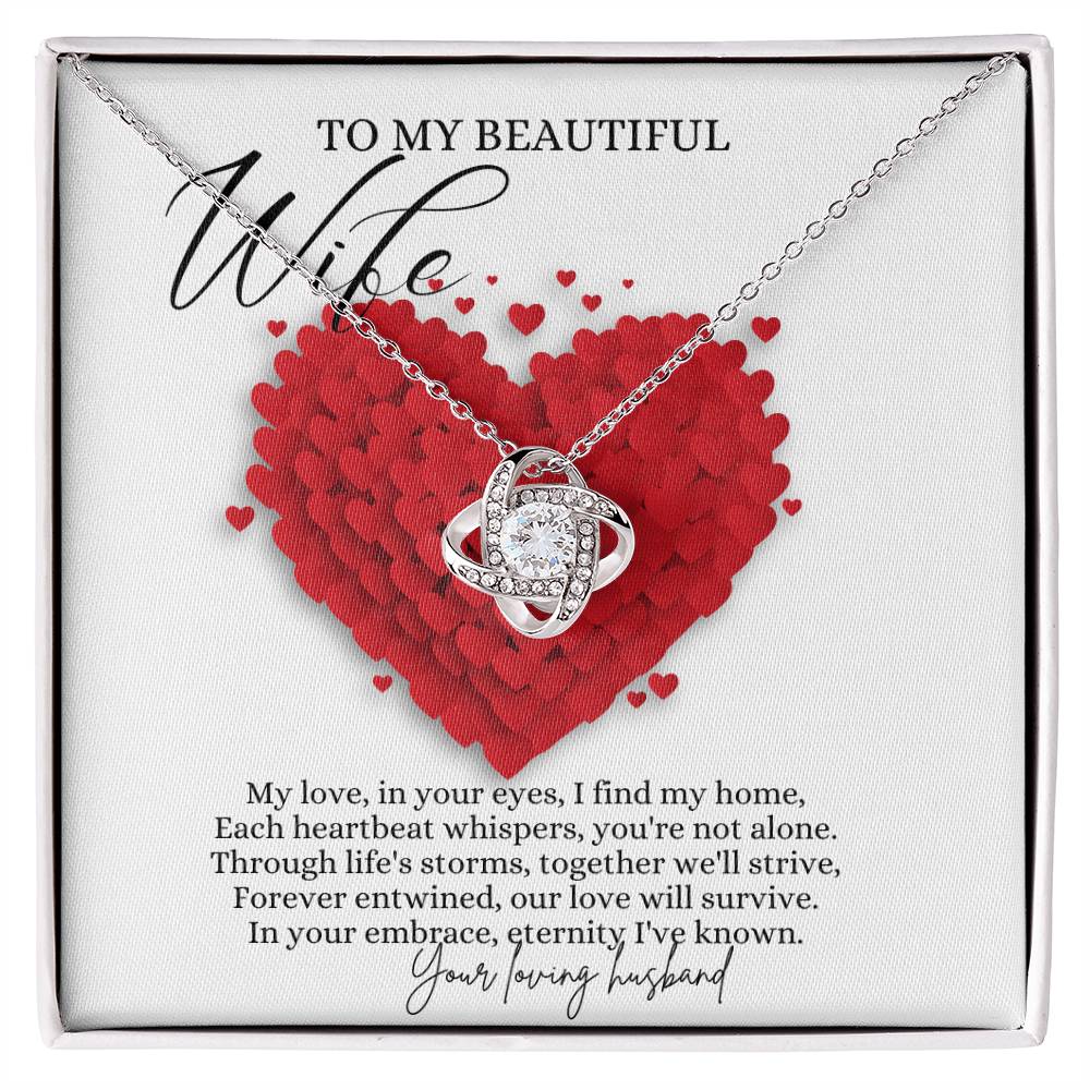 A Jewelry box,  with a white gold finish necklace gift, with a knot pendant embellished with premium cubic zirconia crystals, and a message card to my beautiful wife.