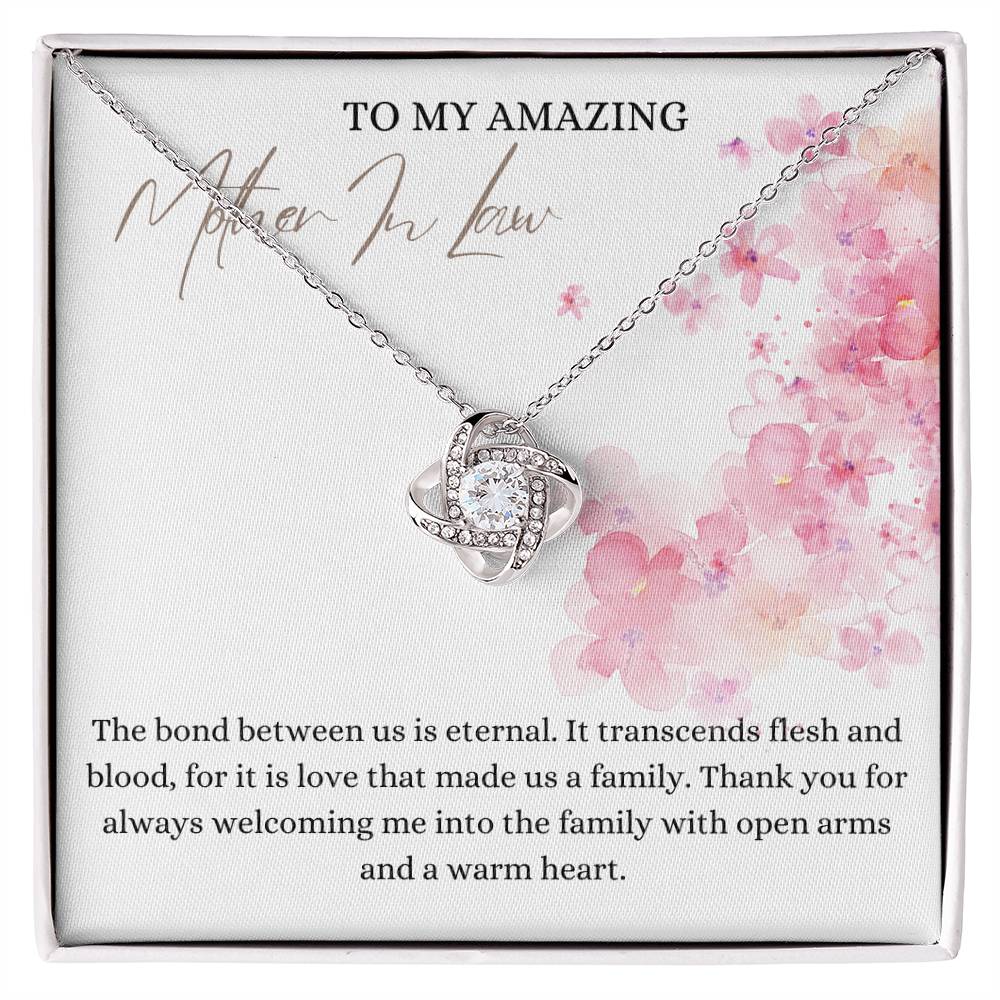 A white gold finish necklace gift, with a knot pendant embellished with premium cubic zirconia crystals, and a message card to my amazing mother-in-law, in a Jewelry box.