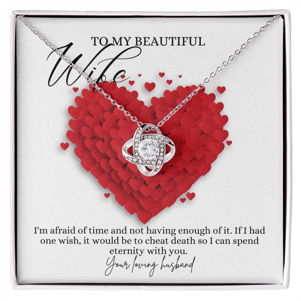 A white gold finish necklace gift, with a knot pendant embellished with premium cubic zirconia crystals, and a message card to my beautiful wife, in a Jewelry box.