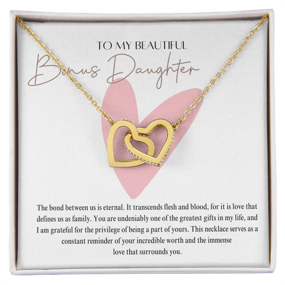 A necklace in a Jewelry gift box, with two connected hearts embellished with cubic zirconia crystals and a gold finish, with a message card to my beautiful bonus daughter.