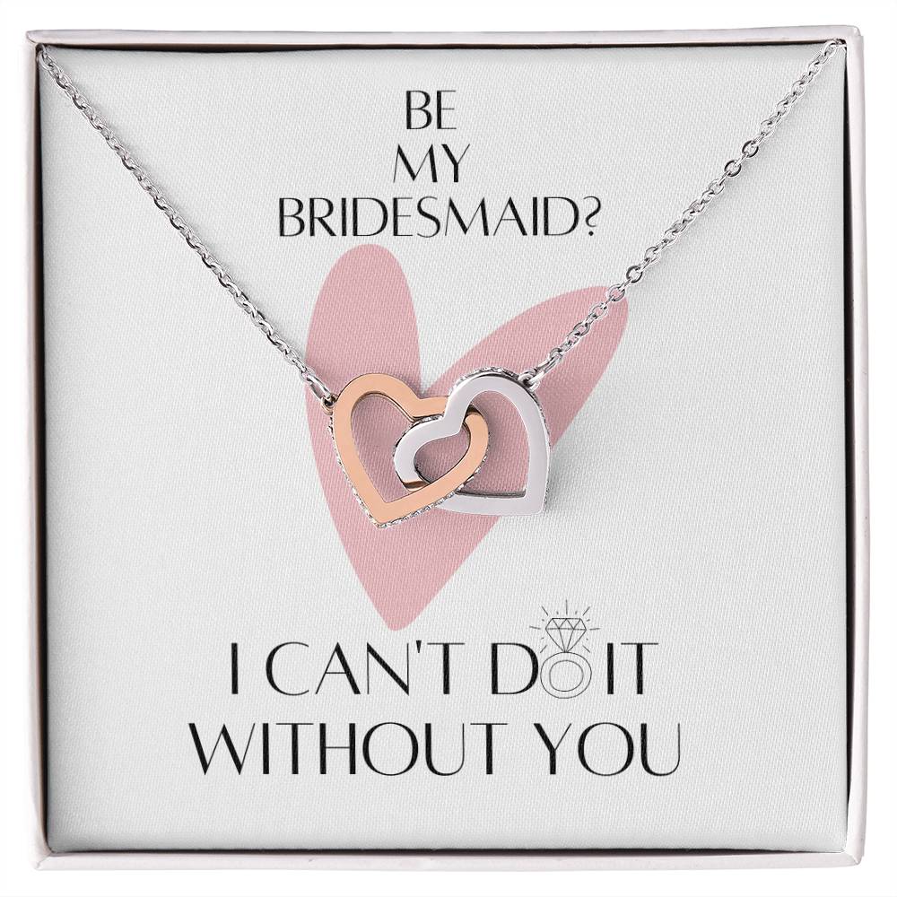 A necklace with two connected hearts embellished with cubic zirconia crystals and white gold finish with a message card for bridesmaids, in a Jewelry gift box.