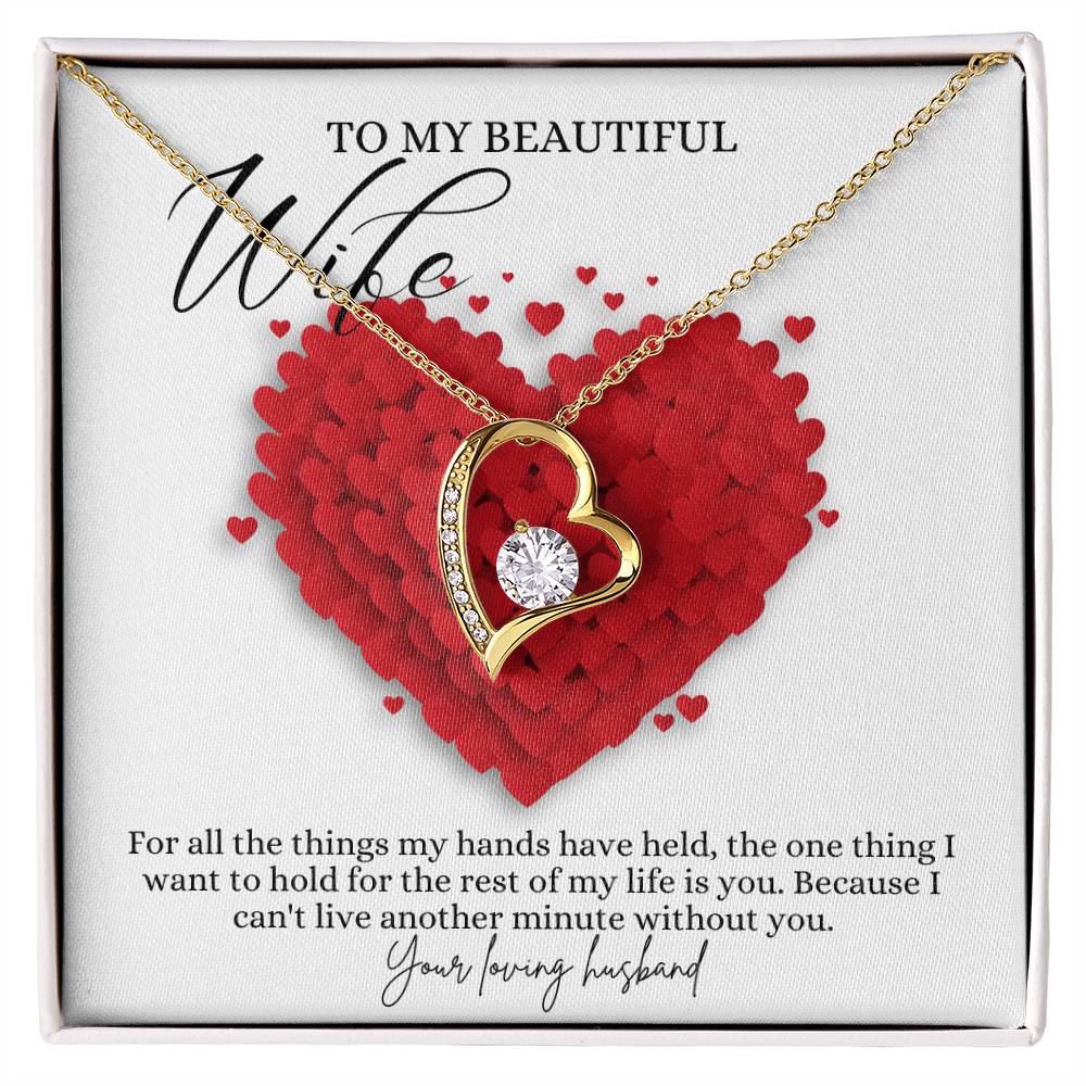 A yellow gold finish necklace gift, featuring a stunning 6.5mm CZ crystal surrounded by a polished heart pendant embellished with smaller crystals, with a message card to my beautiful wife, in a Jewelry box.