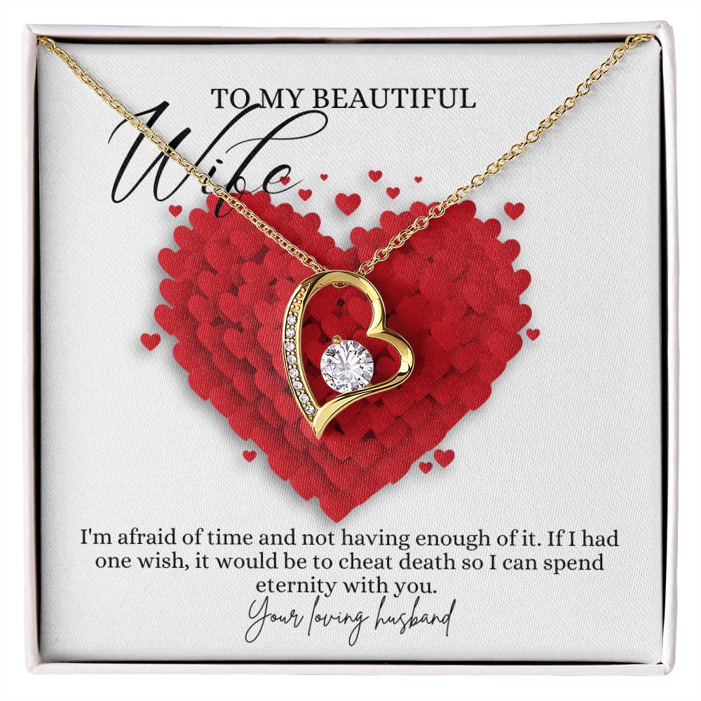 A yellow gold finish necklace gift, featuring a stunning 6.5mm CZ crystal surrounded by a polished heart pendant embellished with smaller crystals, with a message card to my beautiful wife, in a Jewelry box.